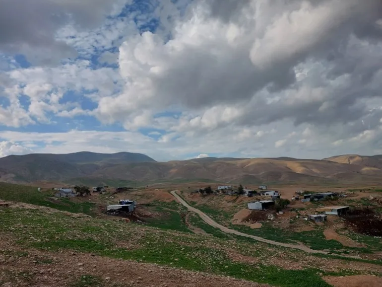 A view of the small settlement nestled in small rises