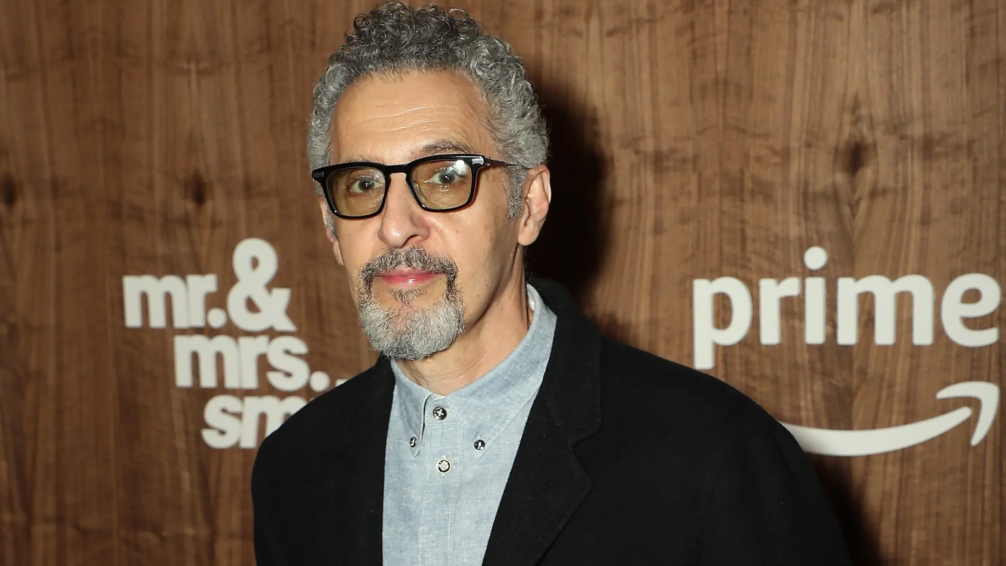 John Turturro poses at 