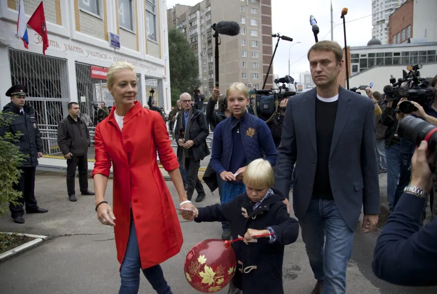 Sept. 8, 2013: Russian opposition leader Alexei Navalny, right, with his wife Yulia, daughter Daria, and son Zakhar leave a polling station in Moscow’s mayoral election. Moscow is holding its first mayoral election in a decade.