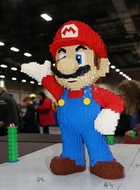 Super Mario welcomes guests at Brick Fest Live at the Iowa Events Center in Des Moines on Saturday, Feb. 17, 2024.