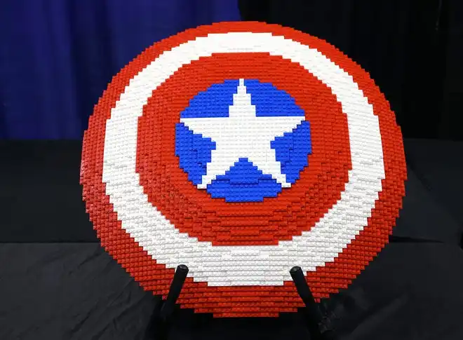 The shield from Captain America appears at Brick Fest Live featuring life-sized models made from Legos, hands-on activities, and a meet-and-greet with Manny from the 