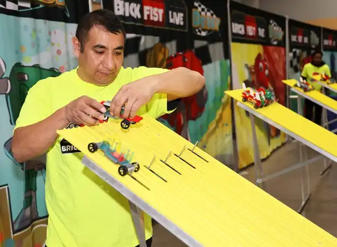 Kid-built cars are ready to race at Brick Fest Live featuring life-sized models made from Legos, hands-on activities, and a meet-and-greet with Manny from the 