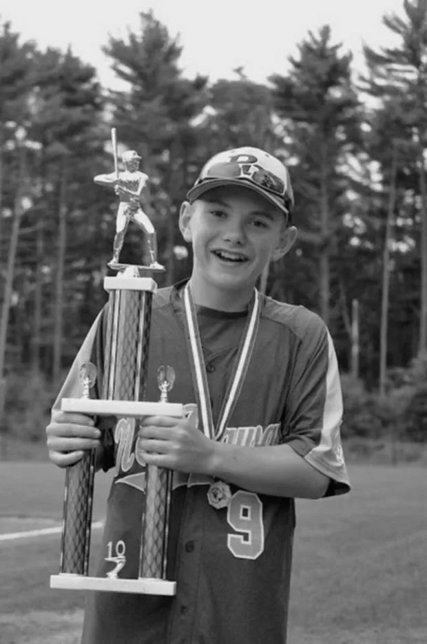 Andrew Curtis with a baseball award. (Courtesy Harry B. Curtis)