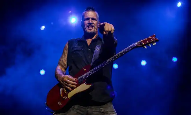 Dan Donegan of Disturbed pointed to the crowd as he performed on the Barrel stage at the Louder Than Life Music Festival on Sunday, September 29, 2019, in Louisville, Kentucky.