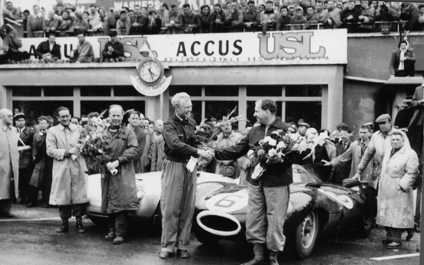 Not the happiest of victories. Here with Ivor Bueb, another talented Brit, at the finish. Sadly, Bueb died at Charade in 1959.