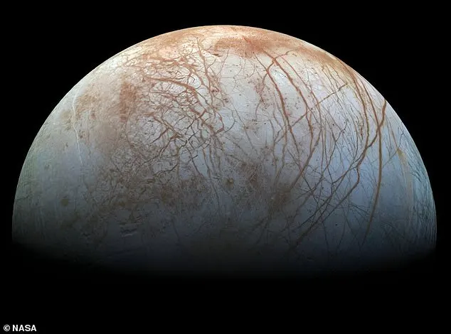 Pictured, Jupiter’s moon Europa, where an ocean hidden under kilometers of ice is considered a prime candidate for extraterrestrial life. Scientists have found carbon dioxide (CO2) on Europa’s surface and the next step is determining where it came from