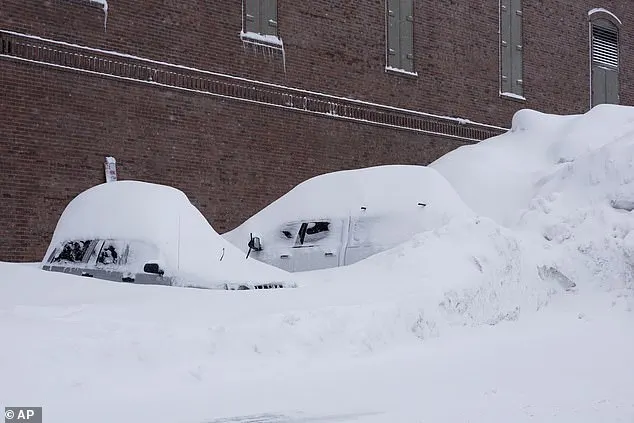 Vehicles are covered in snow during a storm, Sunday, March 3, 2024, in Truckee