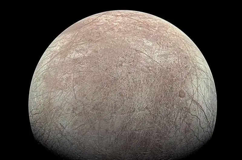 This image provided by NASA, processed by Kevin M. Gill, shows Jupiter's moon Europa captured by the Juno spacecraft on Sept. 29, 2022, with north to the left. Research published Monday, March 4, 2024, suggests there's less oxygen on the icy surface of Jupiter's moon Europa than thought — and that could affect what if any life might be lurking in the moon’s underground ocean. Credit: Kevin M. Gill/NASA/JPL-Caltech/SwRI via AP Jupiter's moon Europa may have less oxygen than expected, a finding that might put a damper on life