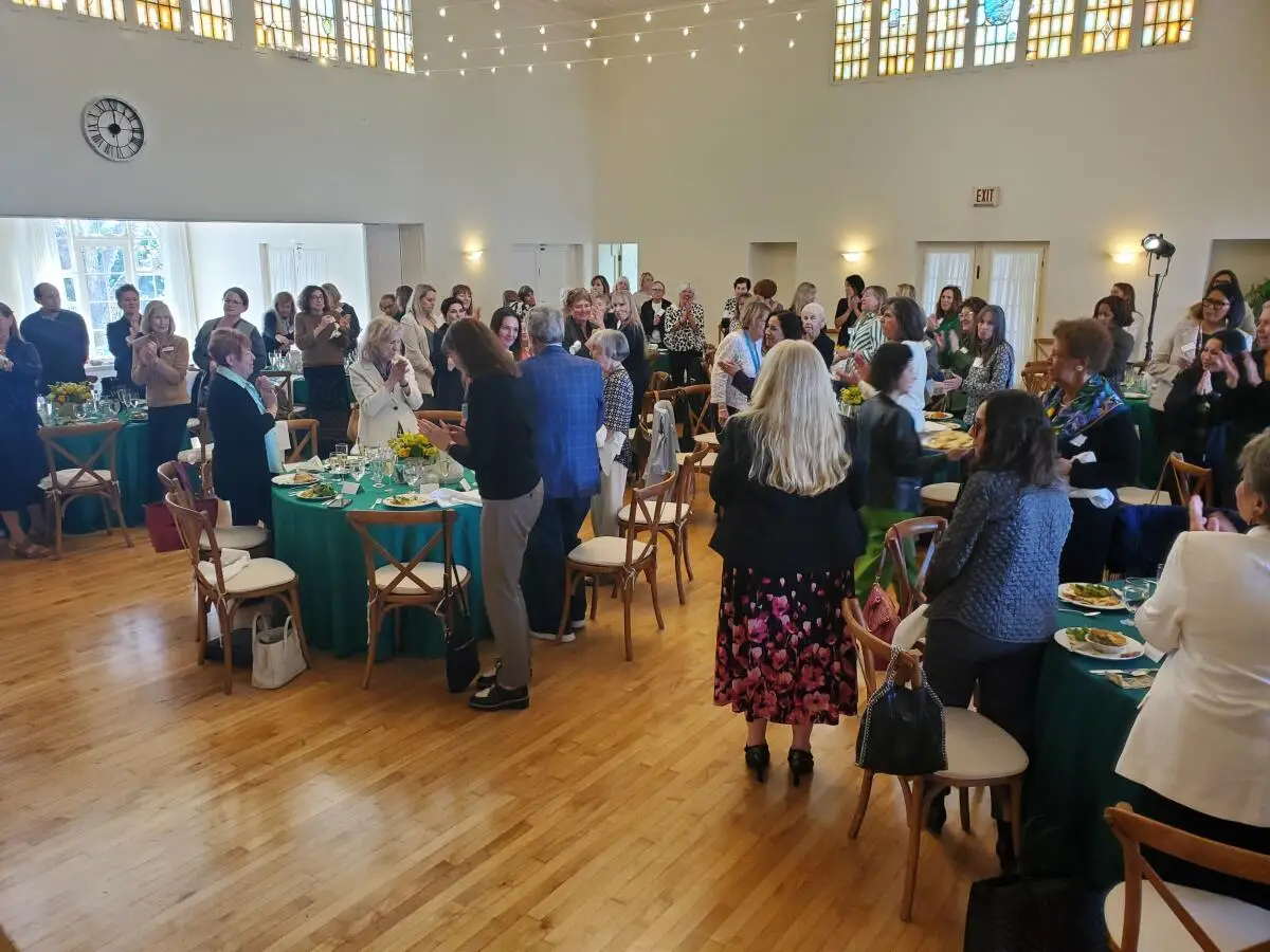 Noreen Haygood gets a standing ovation at a La Jolla Woman's Club lunch held in her honor March 4.