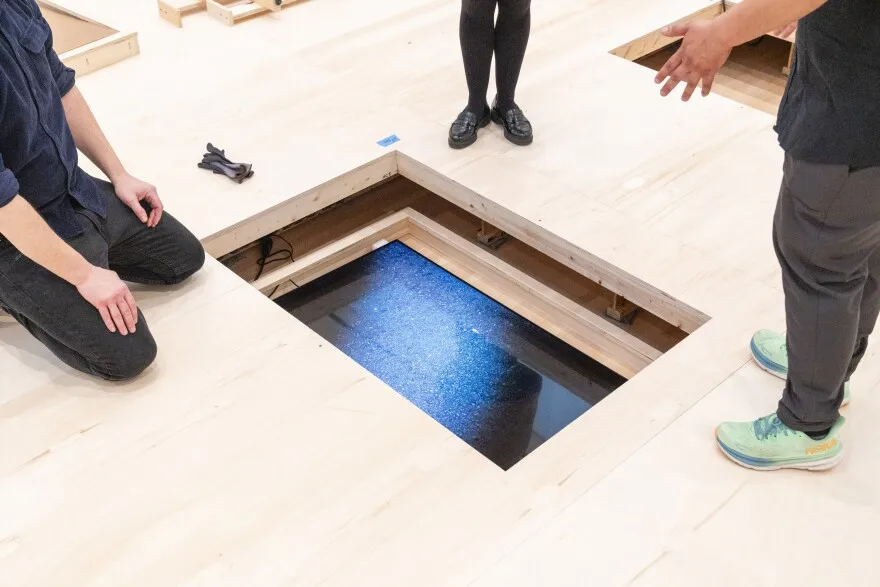 Kahlil Robert Irving oversees installation a television screen as part of his exhibition “Archaeology of the Present” on Friday, Feb. 16, 2024 at the Mildred Lane Kemper Art Museum at Washington University in St. Louis. The exhibition will open to on February 23 and run through July 29.