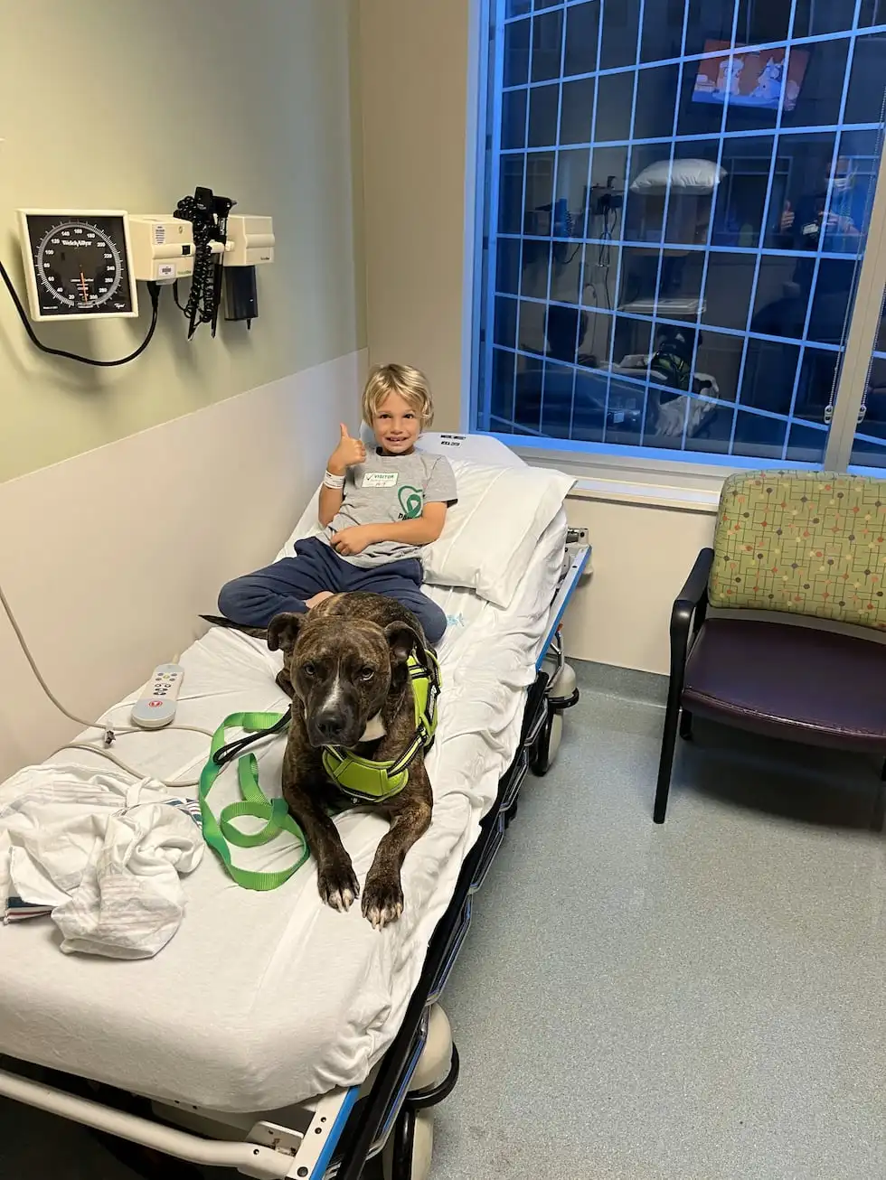 Jameson gives a thumbs-up to the camera while receiving IVIG treatment for PANDAS.