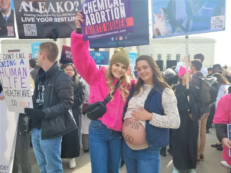 Savanna Deretich (left) with Students for Life and Savannah Evans (right) with Live Action stand in front of the Supreme Court building as pro-life demonstrators, March 26, 2024. Credit: Peter Pinedo/CNA