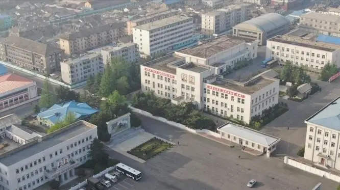 A civilian drone launched from Dandong, China, captures an image of people standing around in the North Korean border city of Sinuiju in this 2020 photo. Captured from Reddit