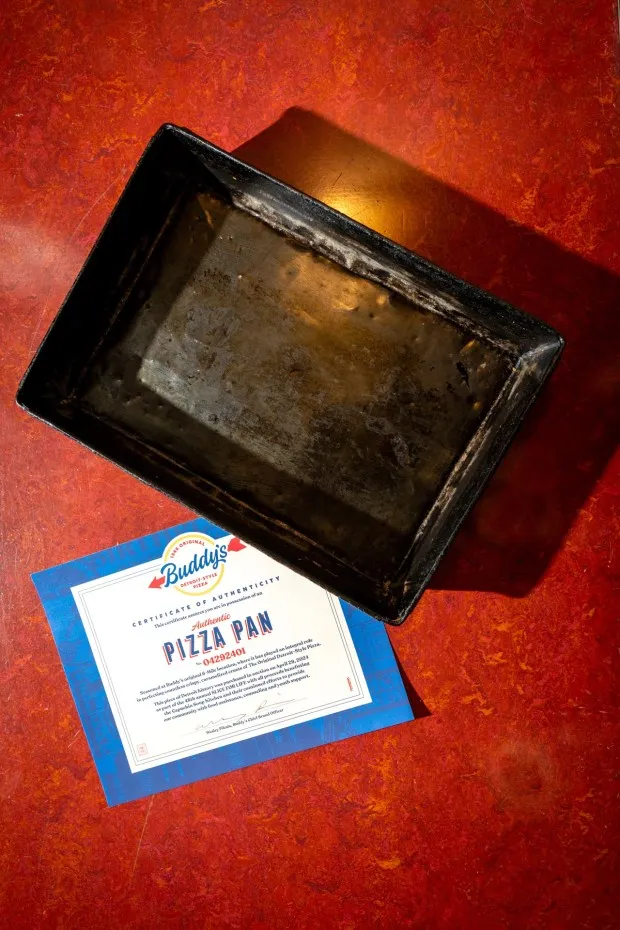 Want to own a slice of history? Buddy’s Pizza will be auctioning off a few of its square cooking pans to raise money for the Capuchin Soup Kitchen on April 29. Photo courtesy of Buddy’s Pizza