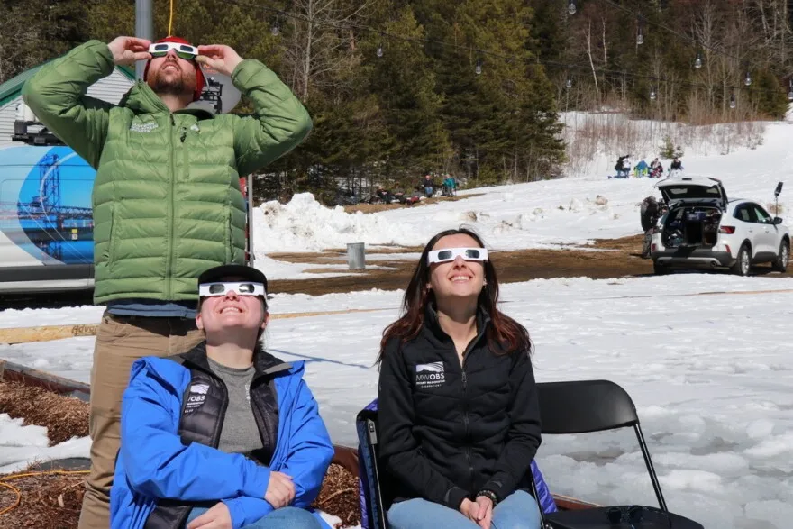 Staff from Mount Washington Observatory observe the eclipse on April 8 at Coleman State Park.