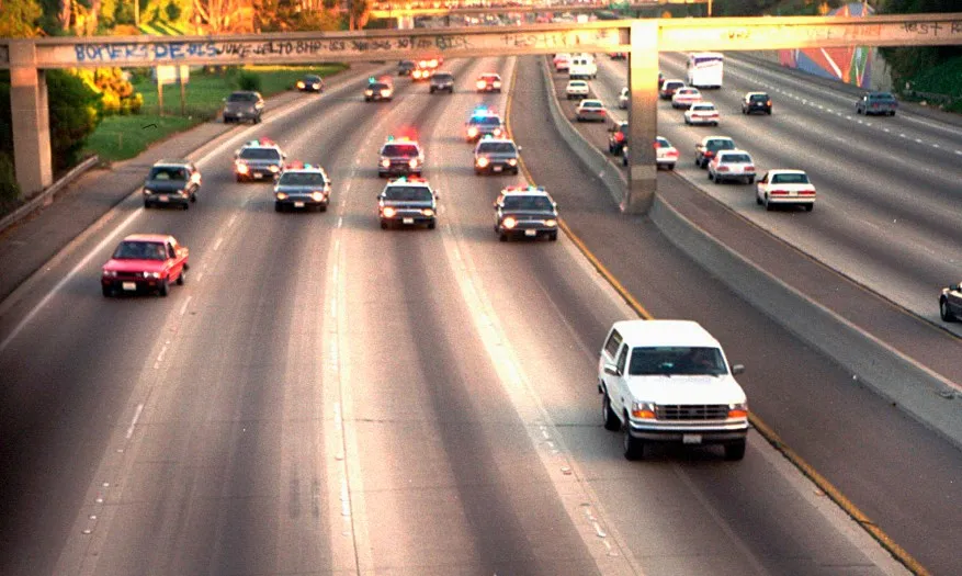 O.J. Simpson was trailed by Los Angeles police cars in a high speed chase on a Southern California freeway in Los Angeles on June 17, 1994 after being charged with two counts of murder.