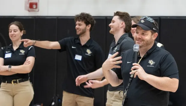 UCF coordinator Michael Callahan instructs about 50 students auditioning for the UCF Mascot Knightro at The Venue Orlando, Fla., Saturday, April 6, 2024. Callahan took the students through a series of games, dances, interviews, and improvisations to find the next group to put on the Knightro uniform. (Willie J. Allen Jr./Orlando Sentinel)