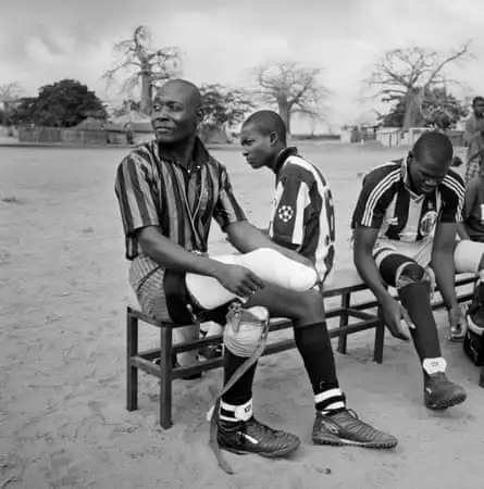 Fighting spirit … war veterans pull on false limbs for a football match in Angola.