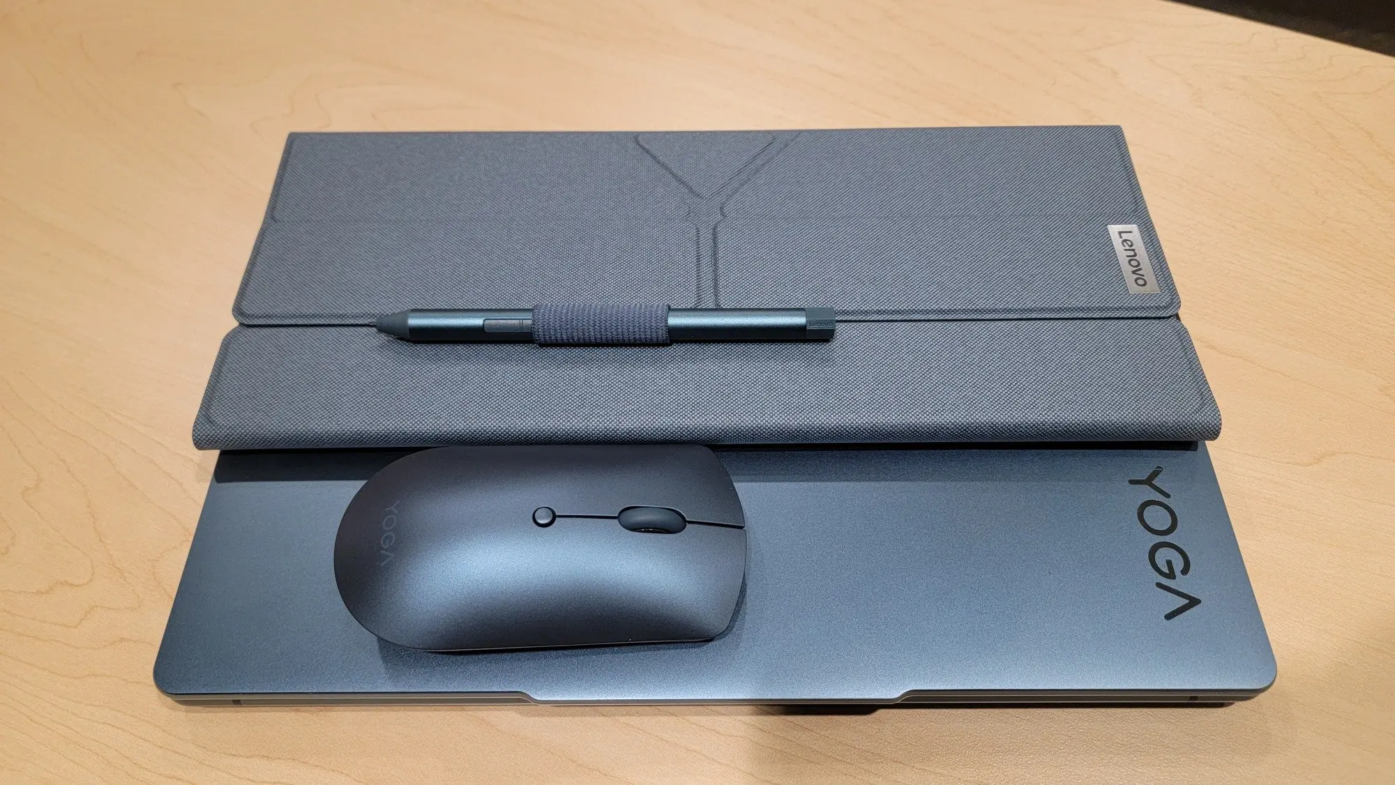 Yoga Book 9i keyboard, mouse and pen on a table