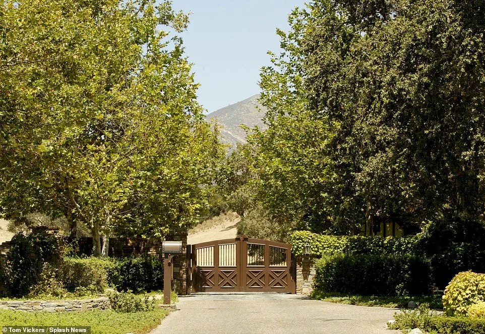 The long driveway up to the property started behind a set of large brown gates (pictured 2003)