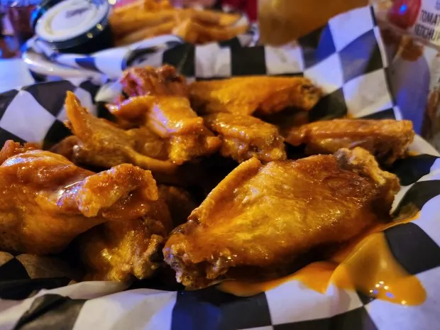 During a recent visit to The Shop Bar and Grill in Painesville Township, the wings, including these mild wings, were crispy on the outside but tender inside. (Mark Koestner - For The News-Herald)