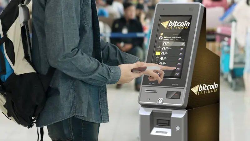 Promotional image of a man using a machine that looks like an ATM and is labeled