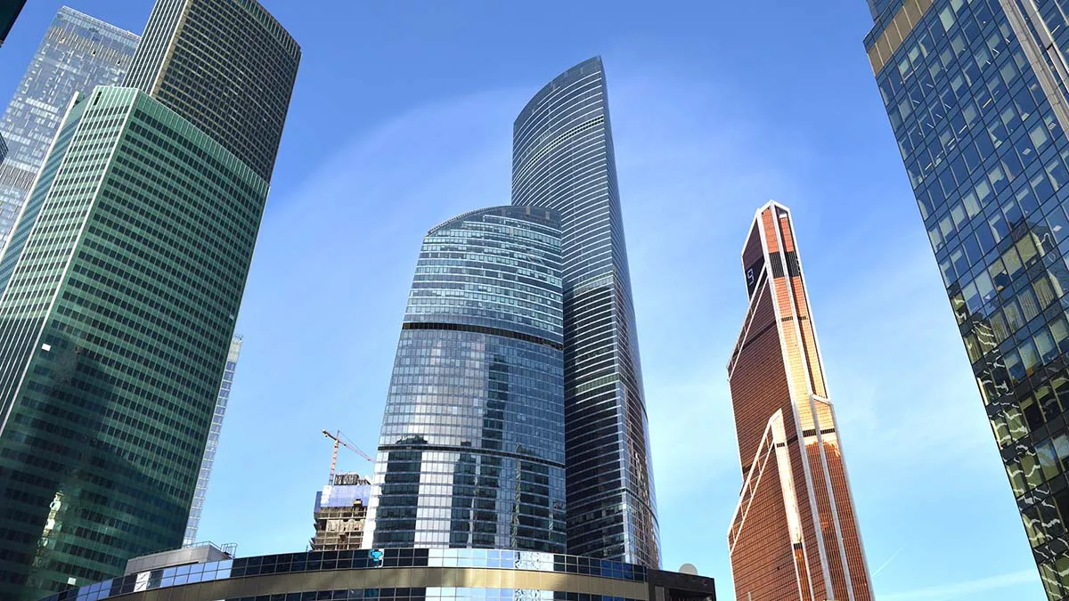 Skyline showing a series of skyscrapers, with two towers standing out against a blue sky in the center of the photo.