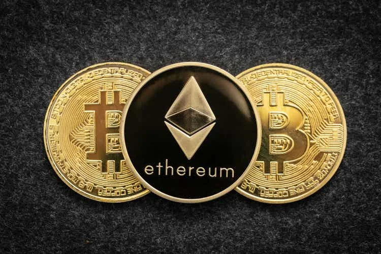 Ethereum cryptocurrency physical coin and bitcoin.