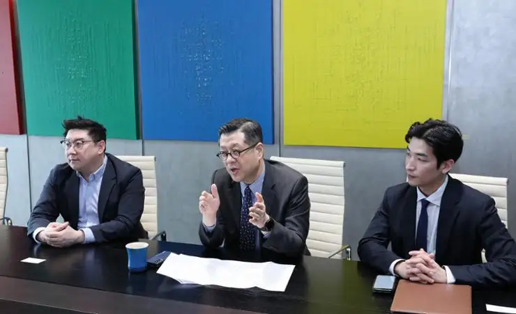 Yulchon's Head of IP & Technology Practice Group Son Do-il, center, speaks during an interview with The Korea Times at the law firm's headquarters in southern Seoul on March 6. From left, Head of New Industry IP Team Lim Hyeong-joo, Son, and Lee Han-kyeol, associate and patent attorney at the firm. Courtesy of Yulchon