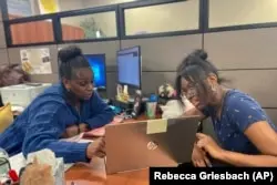 FILE - Success Coach Latasha Wiley, left, helps first-year student Amare Porter, right, with her class schedule at Chattahoochee Valley Community College’s advising center on Feb. 23, 2023. (Rebecca Griesbach/Press-Register via AP)