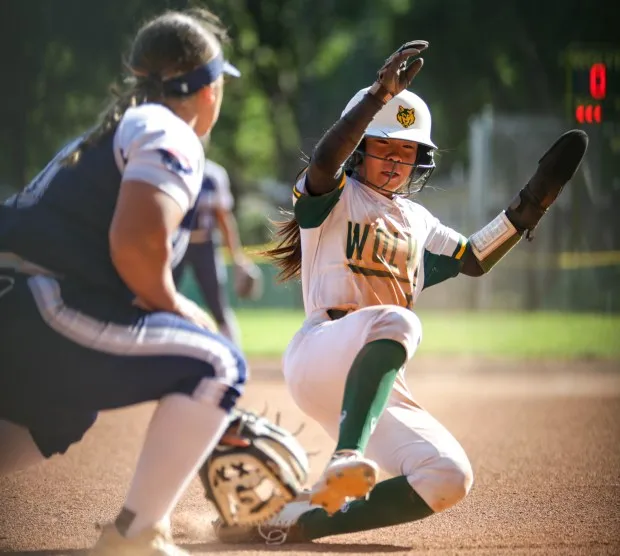 DANVILLE - San Ramon Valley player Sophia Jin (57) steals third base. San Ramon Valley and Freedom played in an NCS Division I high school softball playoff game at San Ramon Valley high school in Danville Calif. on Wednesday, May 24, 2023. (Joseph Dycus/Bay Area News Group)