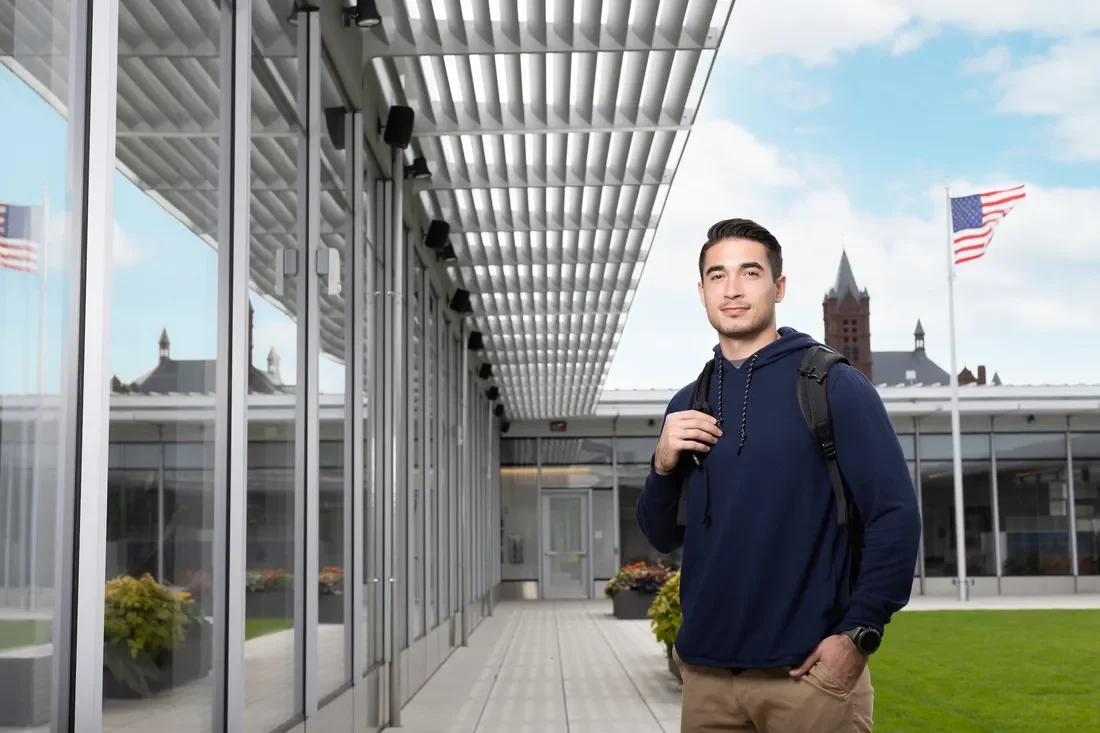 Veteran ambassador student Jack Pullano standing and smiling.