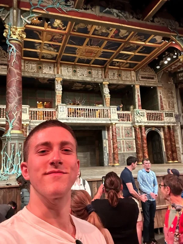 Martin Eschman standing inside the Globe Theater in England