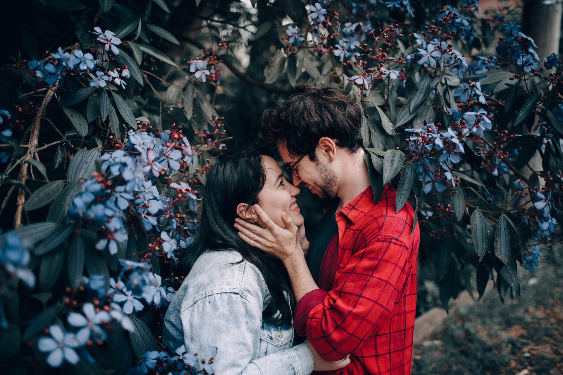 man holding woman's face