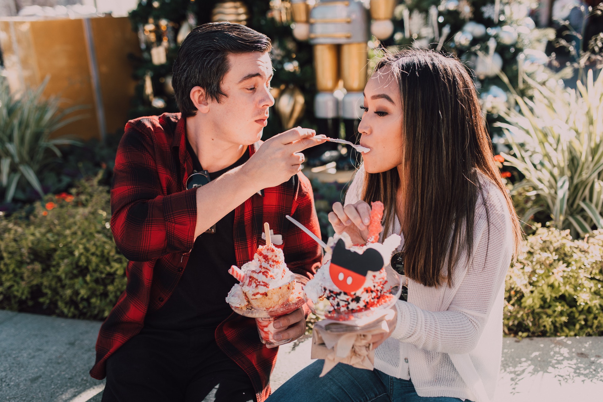 couple feeding dessert