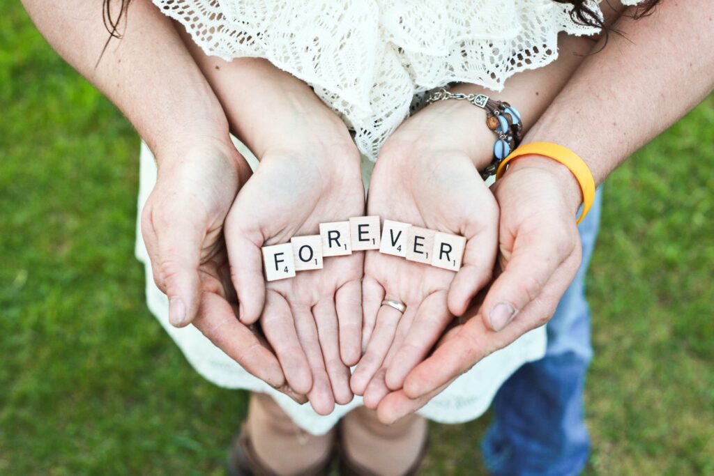 couple holding forever scrabble letters