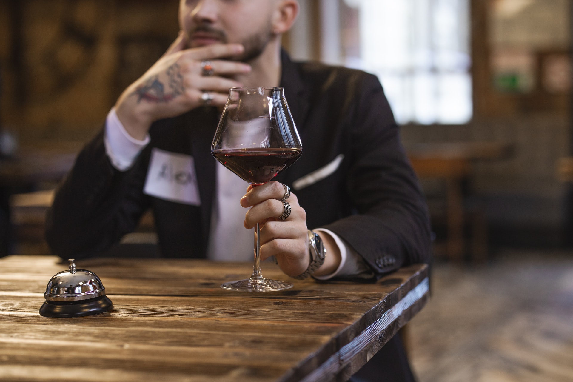 man with a glass of red wine