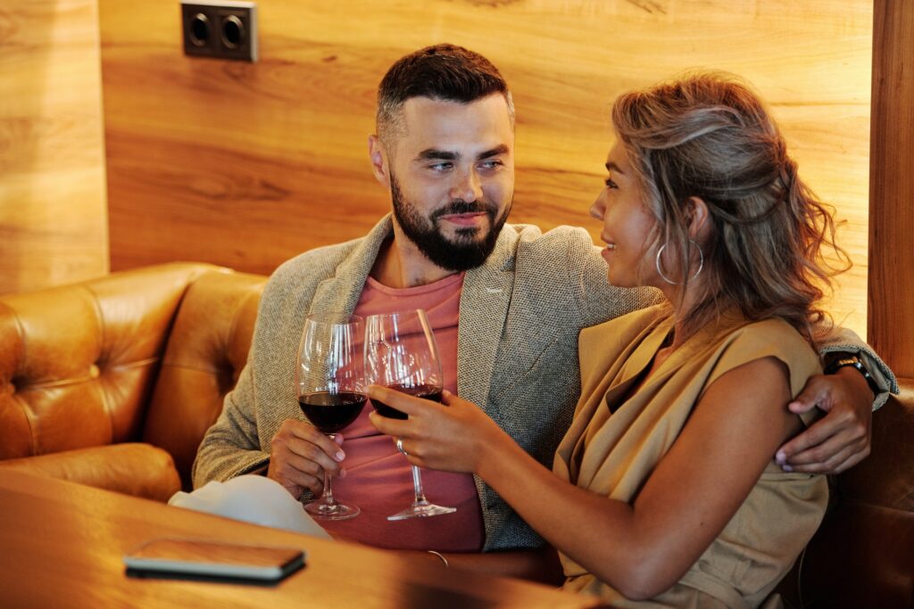couple holding wine glass