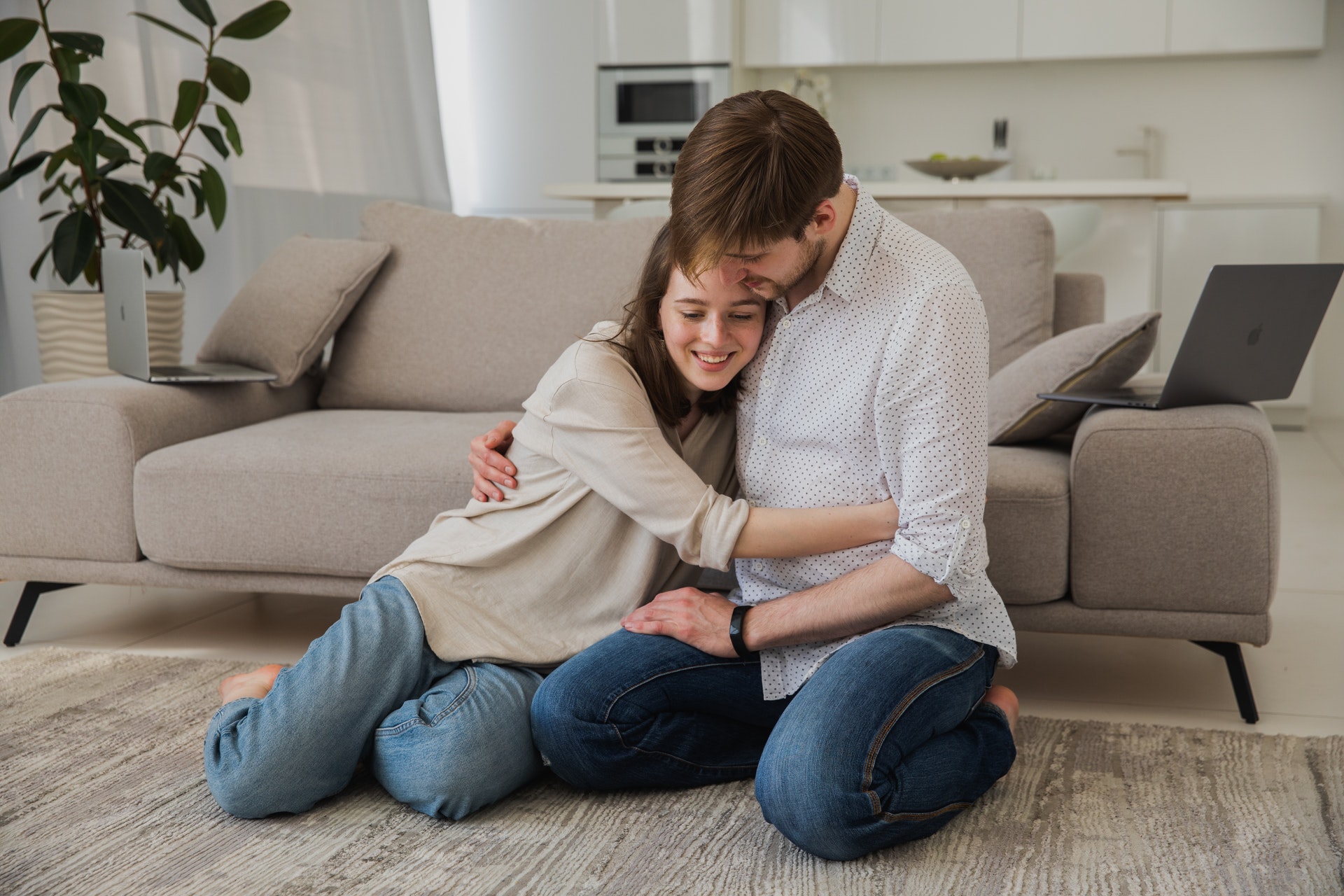 couple hugging in living room