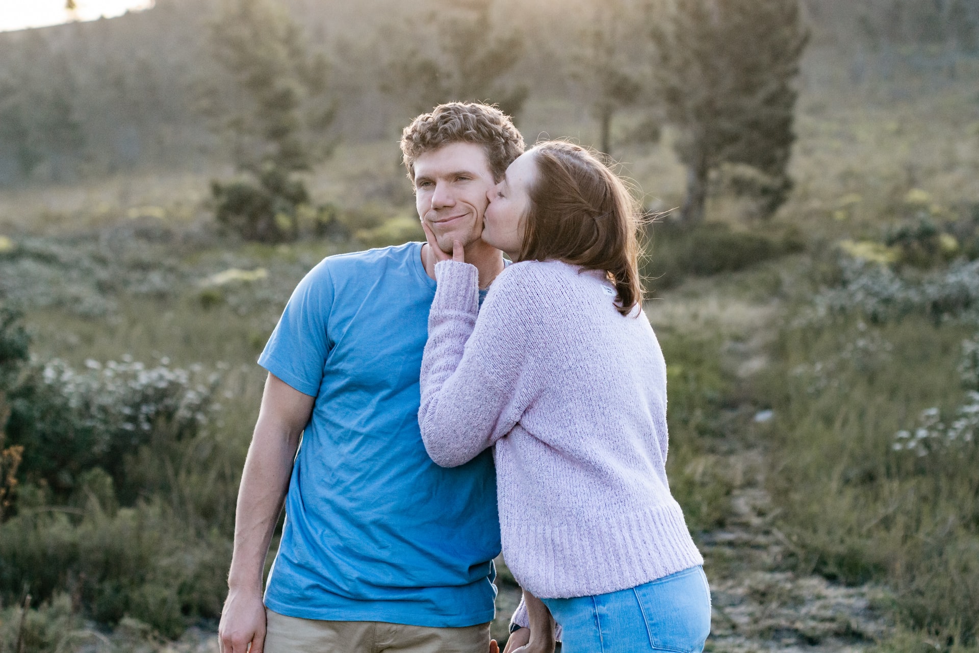 woman kissing on a man