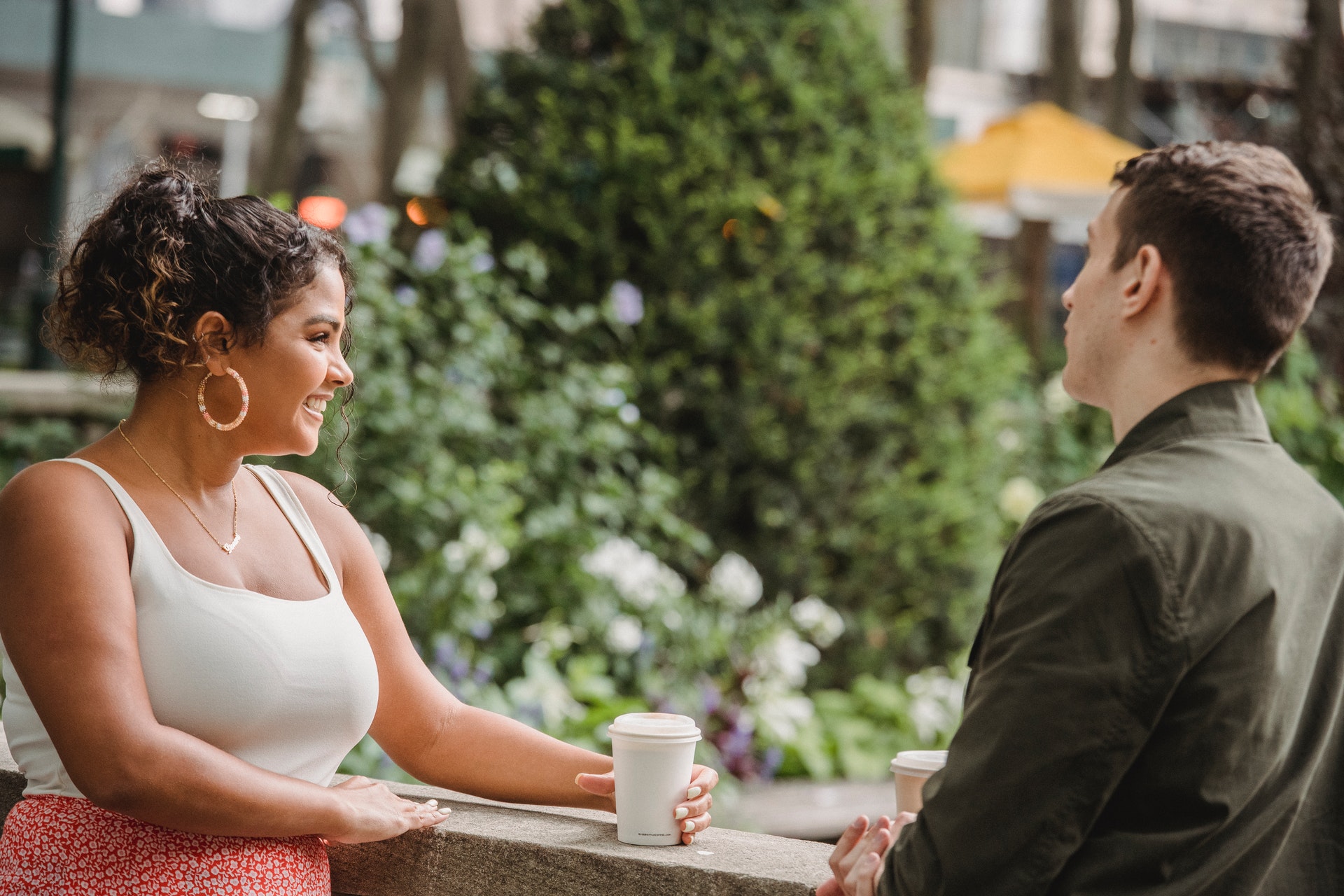 couple drinking takeaway coffee