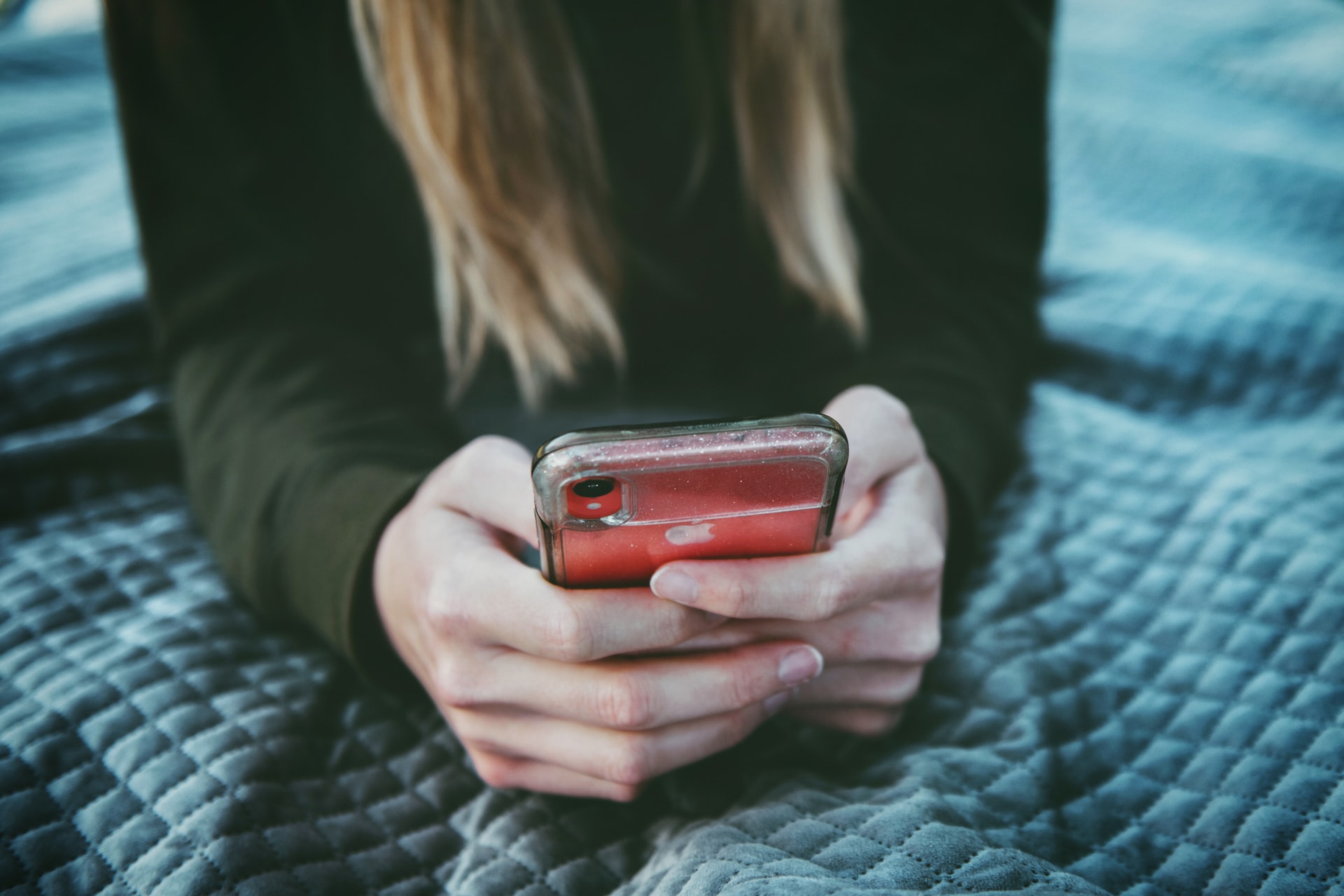 woman holding iPhone