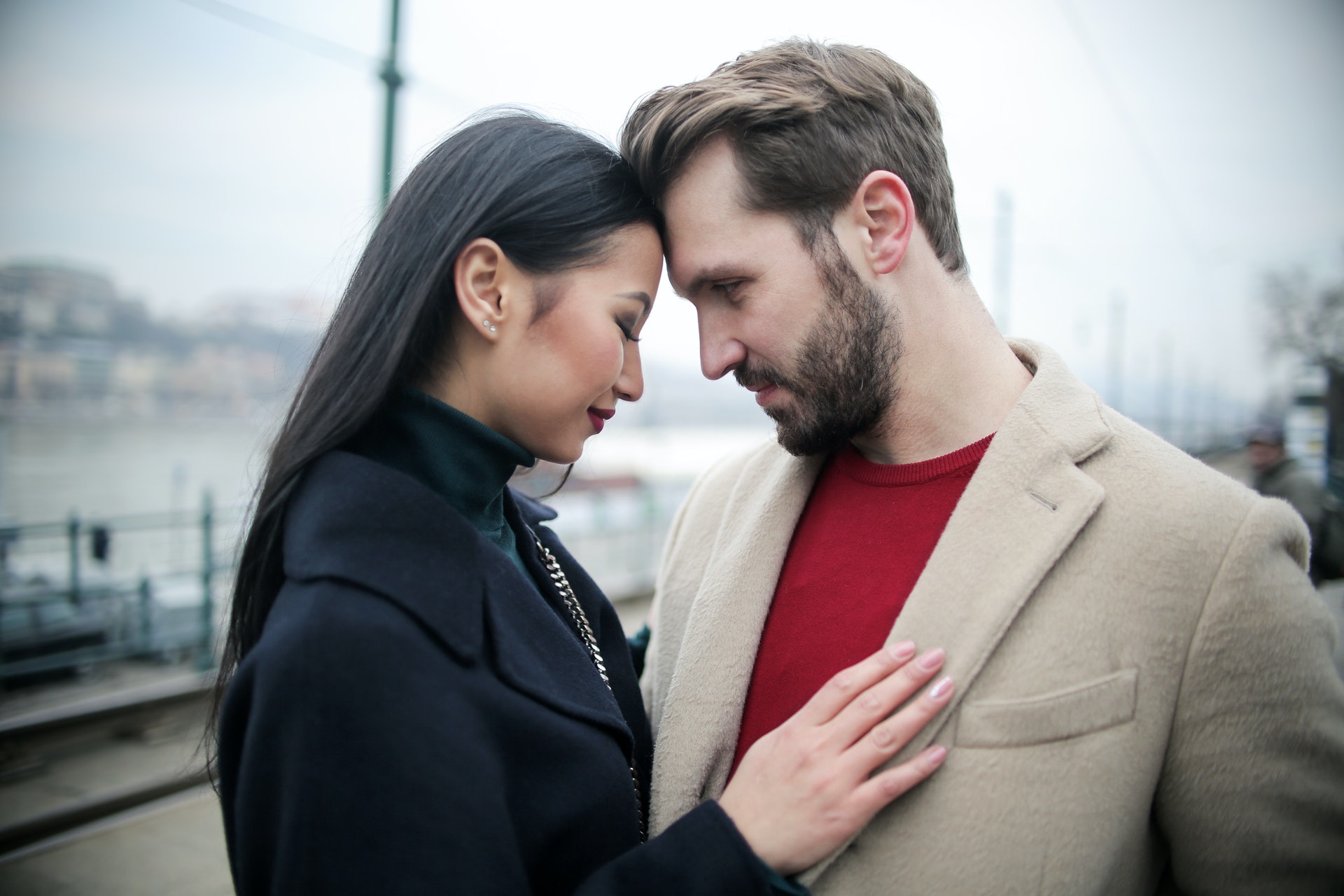 couple hugging on waterfront