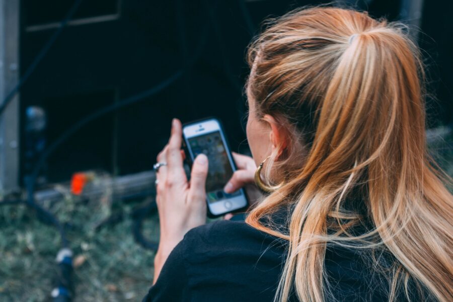 woman using iPhone