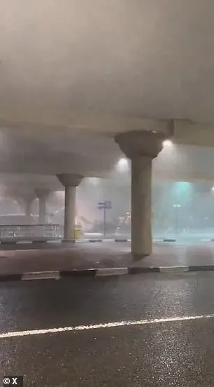 A video shows debris crashing under an underpass as Dubai was lashed with storms