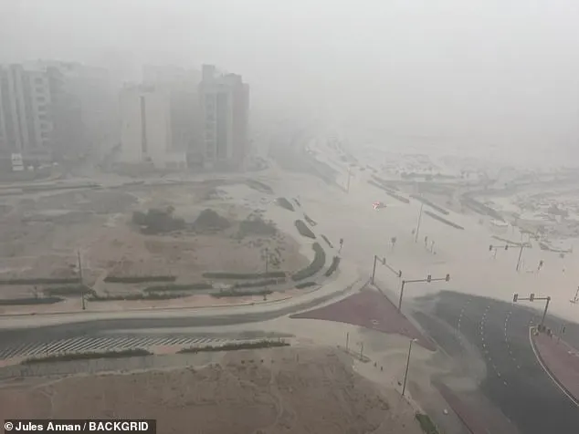 Part of Dubai is seen submerged in water through thick clouds over the city