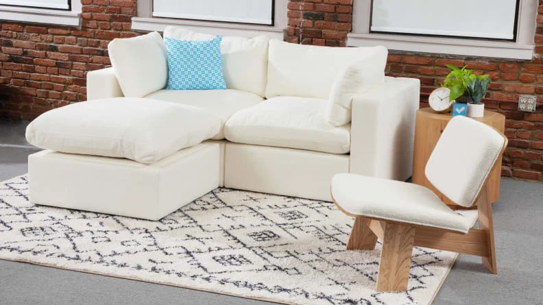 A front facing view of the Cozey Ciello couch and Vela chair.