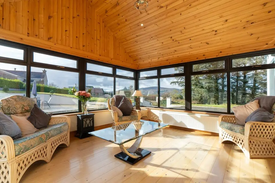 The sunroom with triple-aspect windows