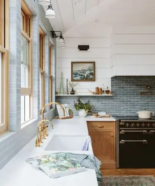 blue kitchen with wooden cabinetry