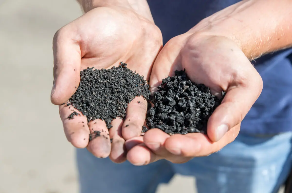 Someone holding rubber mulch